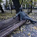 Sculpture - man is sitting on the bench