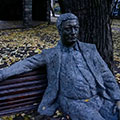 Sculpture - man is sitting on the bench